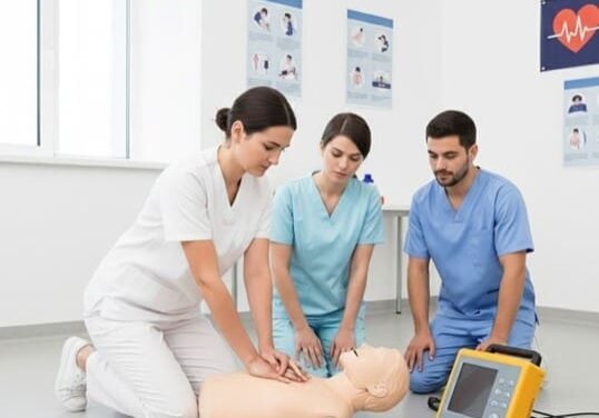 Healthcare workers performing CPR training with AED